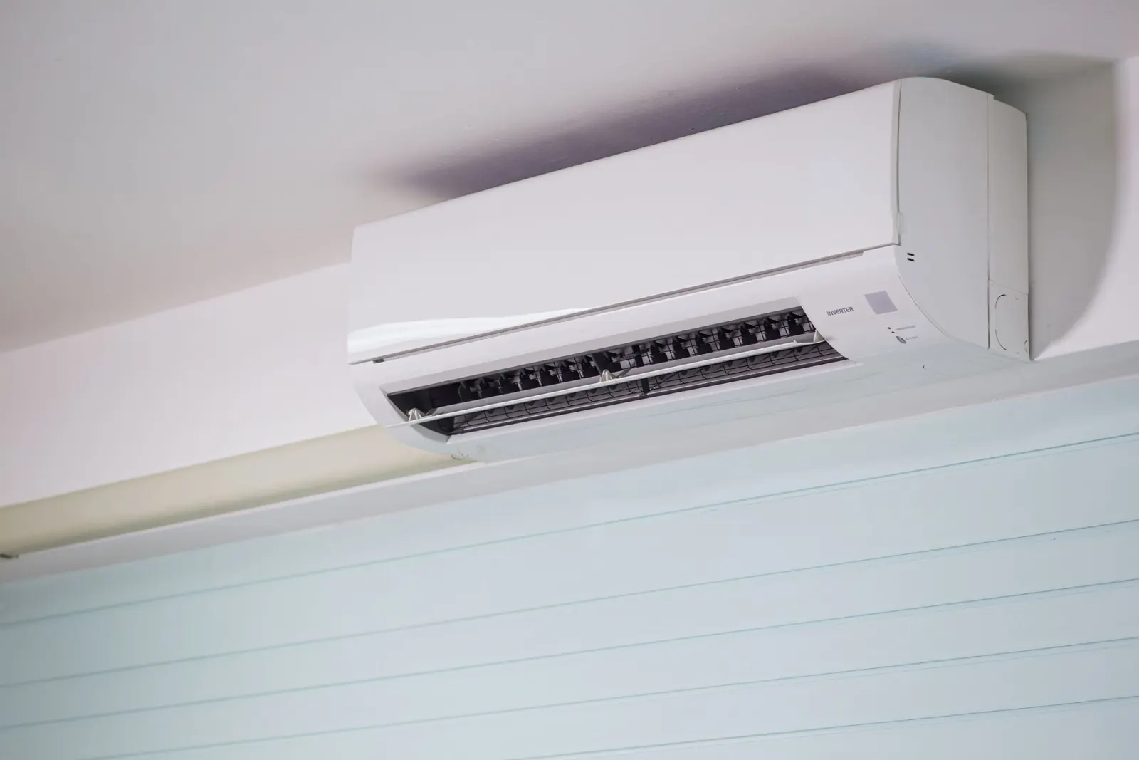 A wall-mounted air conditioning unit in a modern room